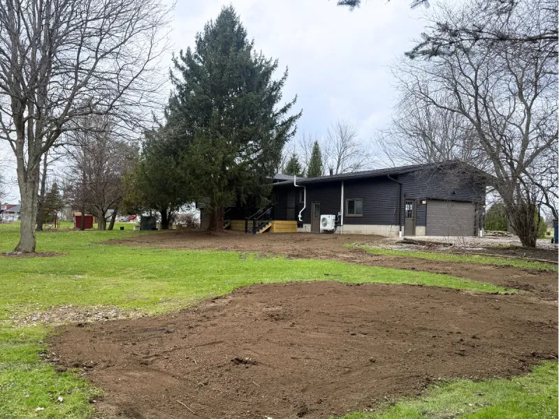 Backyard regraded and reshaped to slope water away from the house near Avon